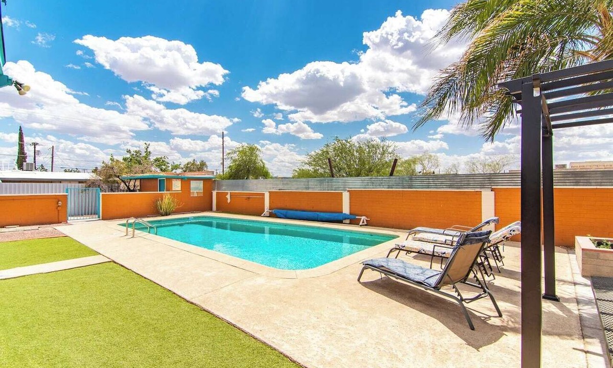 Midtown Apartment | This centrally located 3 bedroom 2 bathroom features a full size pool and electric vehicle charging on site.