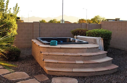 Estrella Village House | Spacious 4-bedroom house with tranquil outdoor space, includes Grill and Spa.