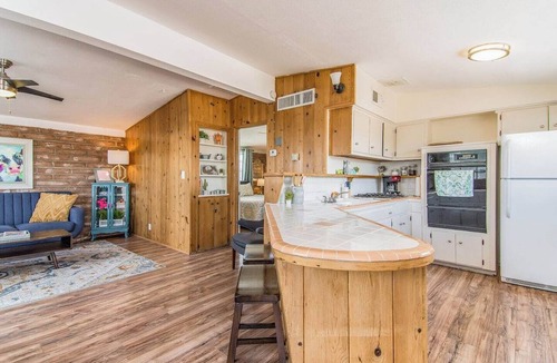 Midtown Apartment | This centrally located 1 bedroom features a full size pool and electric vehicle charging on site.