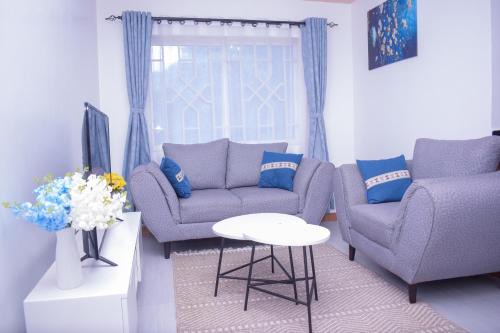 Marvel Homes - Pumzika Modern 1BR Fast WiFi Balcony Near Town Perfect for Work & Stay